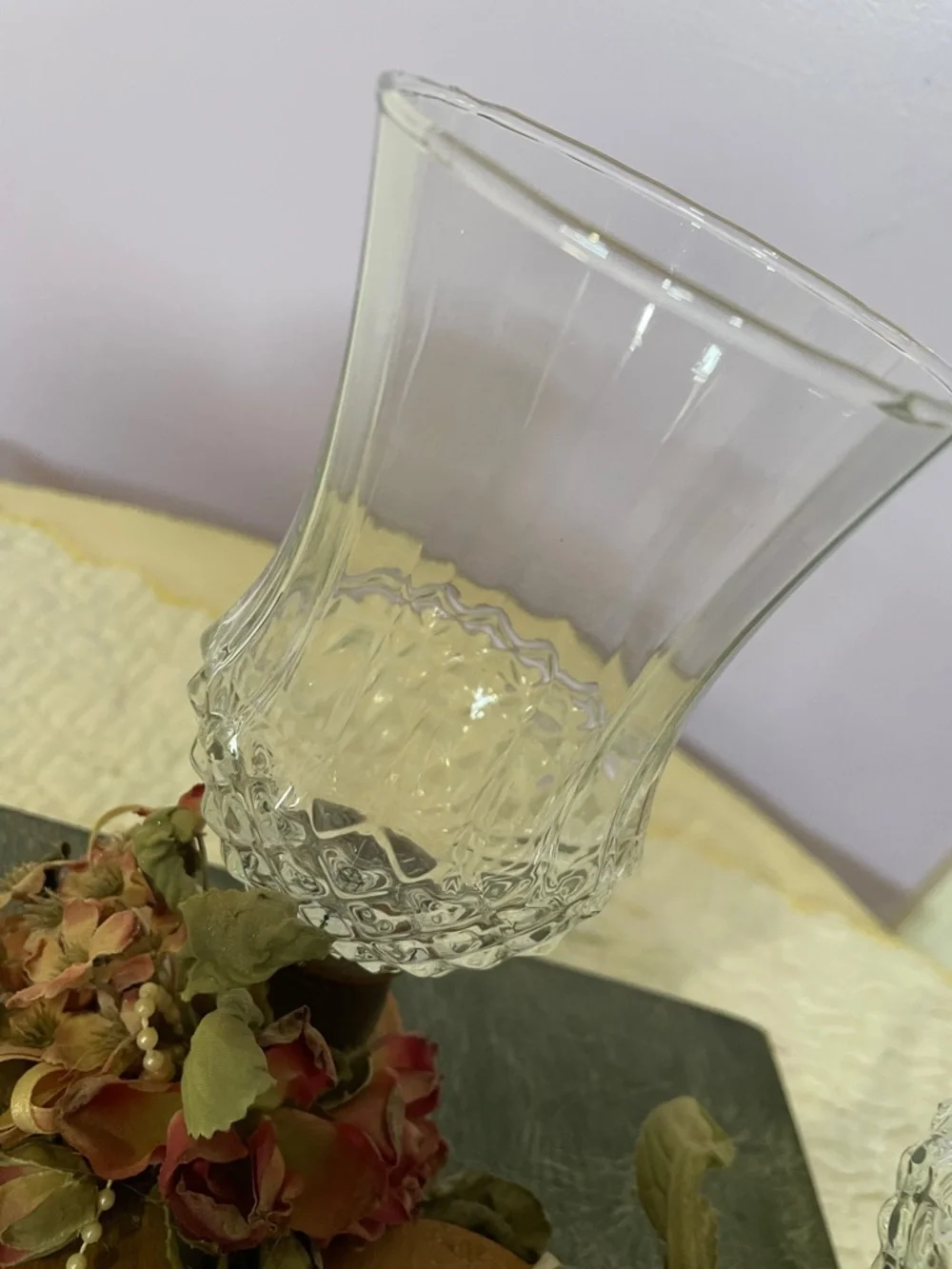 Pair of Vintage Clear Glass Hurricane Candle Holders with Floral Accents on wood